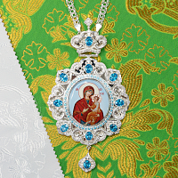 2.7.1520л-2/113л Панагия латунная с голубыми камнями в серебрении